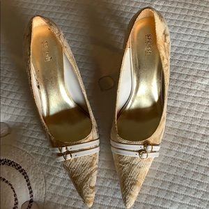 Gold and white dress shoes